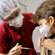 Primeira criança a se vacinar em Goiânia, João Pedro Rocha, de 11 anos